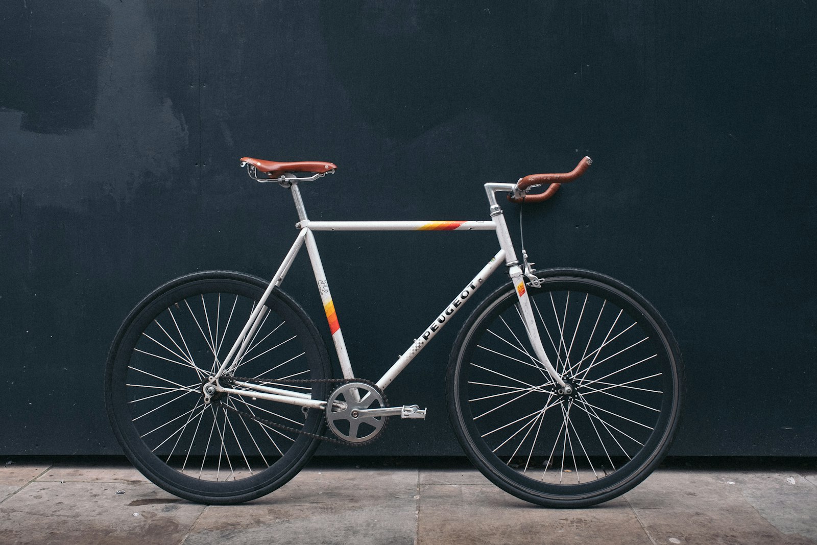 Road bike leaning against a wall