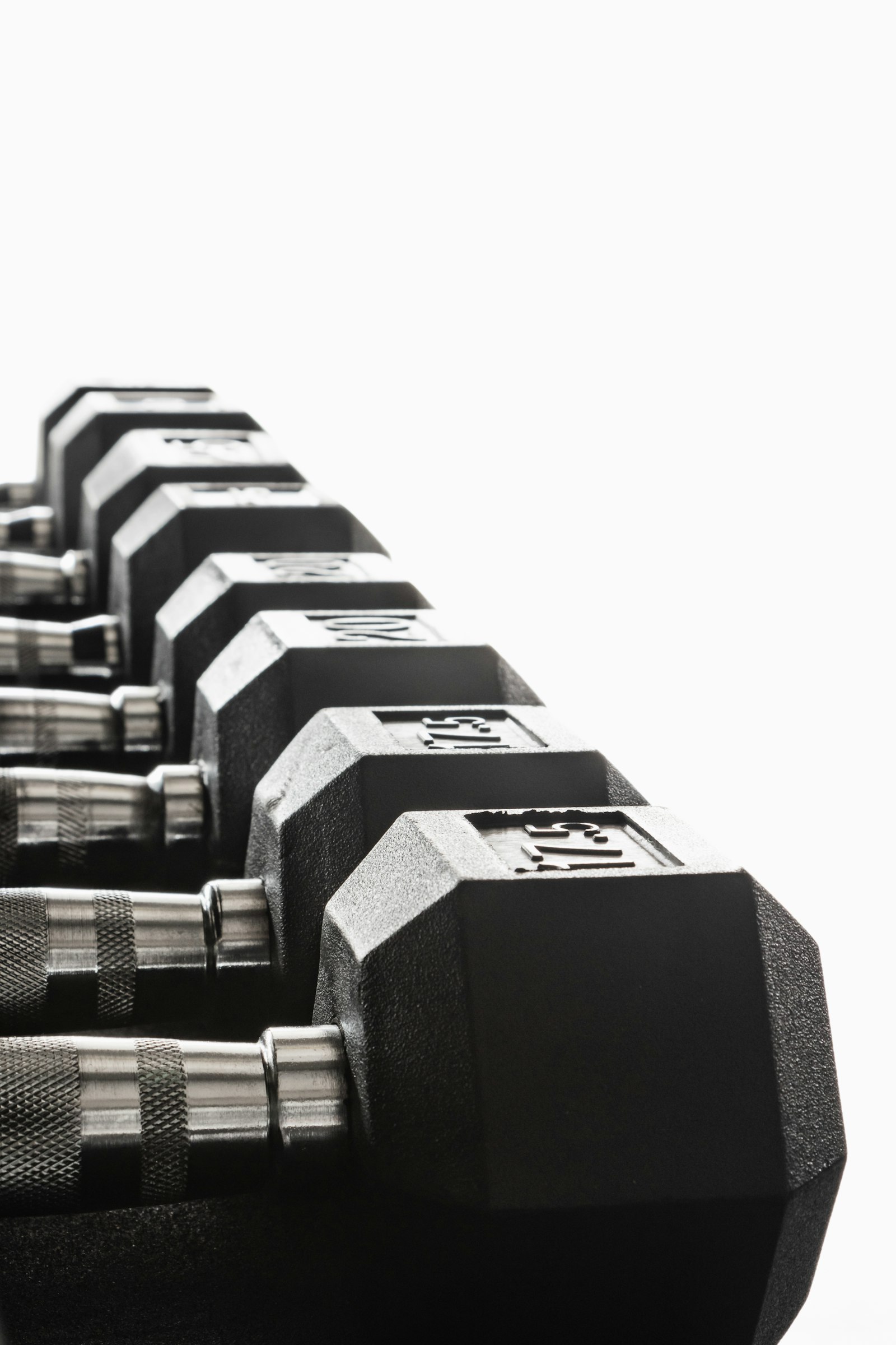 Black and silver dumbbells on a white background